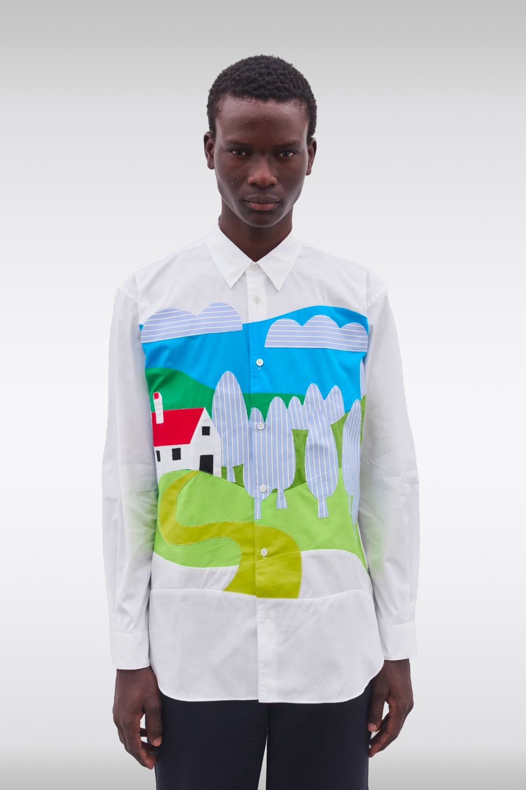 alt-image__White-cotton-shirt-with-patchwork-detailing-featuring-a-landscape-design