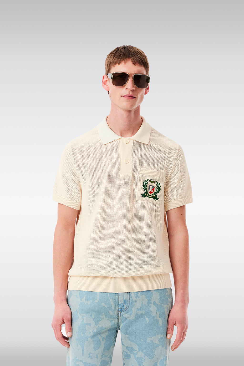 alt-image__Polo-in-maglia-di-cotone-panna-con-stemma-al-petto