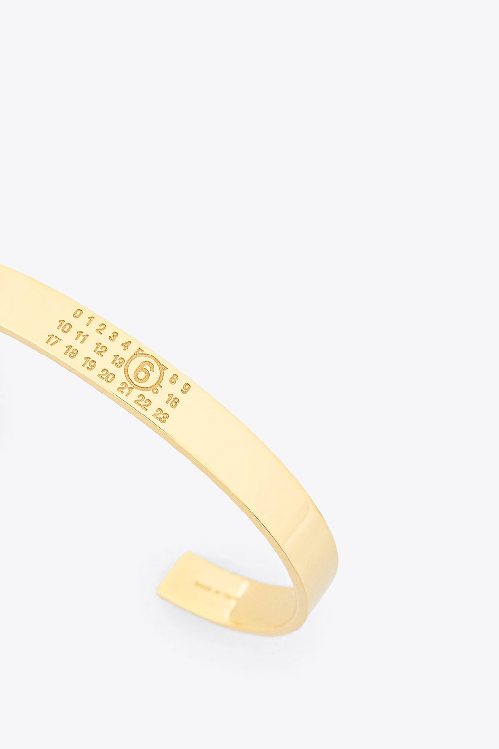 alt-image__Bracciale-rigido-in-metallo-oro-con-logo