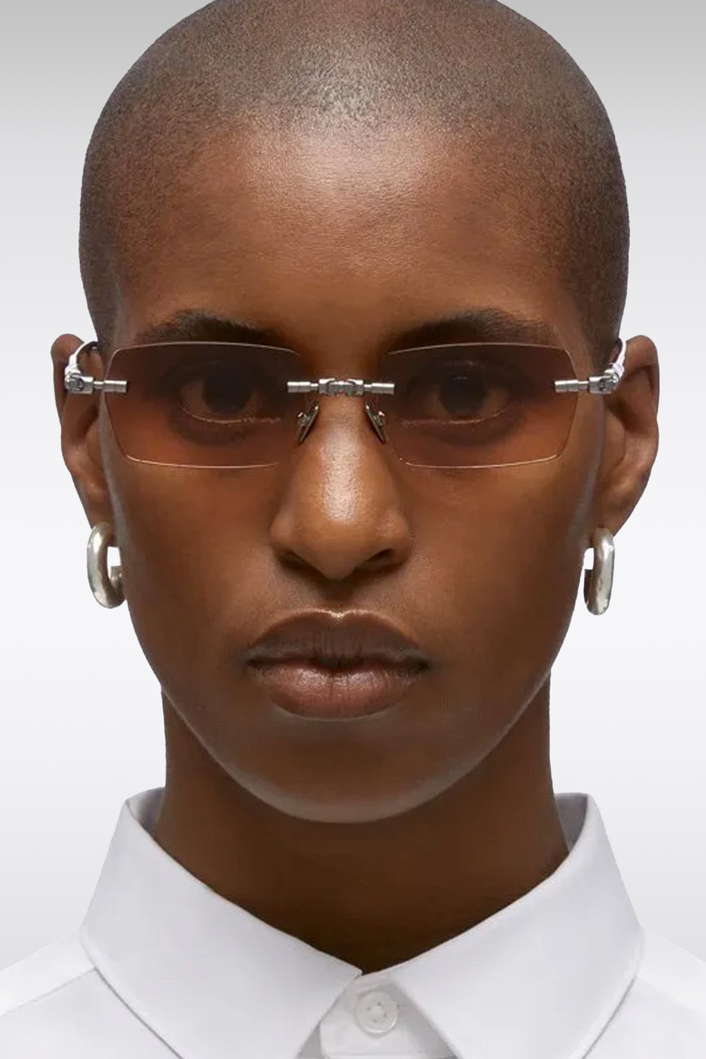 alt-image__Occhiali-rimless-con-lenti-squadrate-arancioni---H61