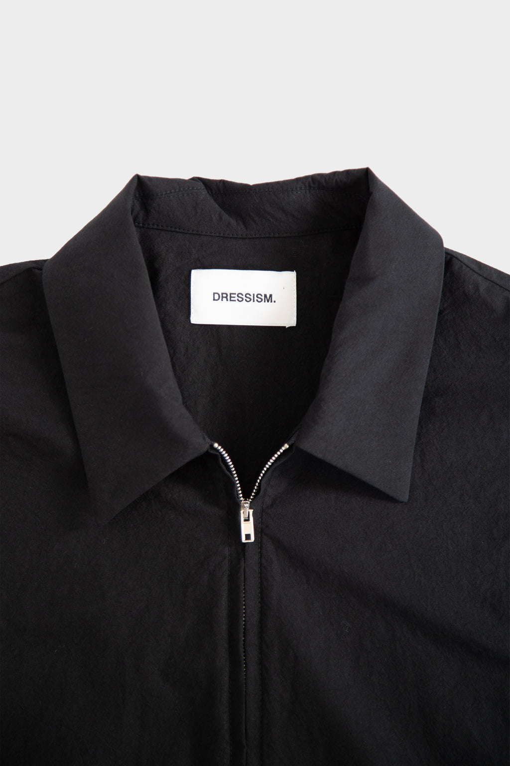 alt-image__Camicia-nera-in-popeline-con-zip-e-maniche-corte