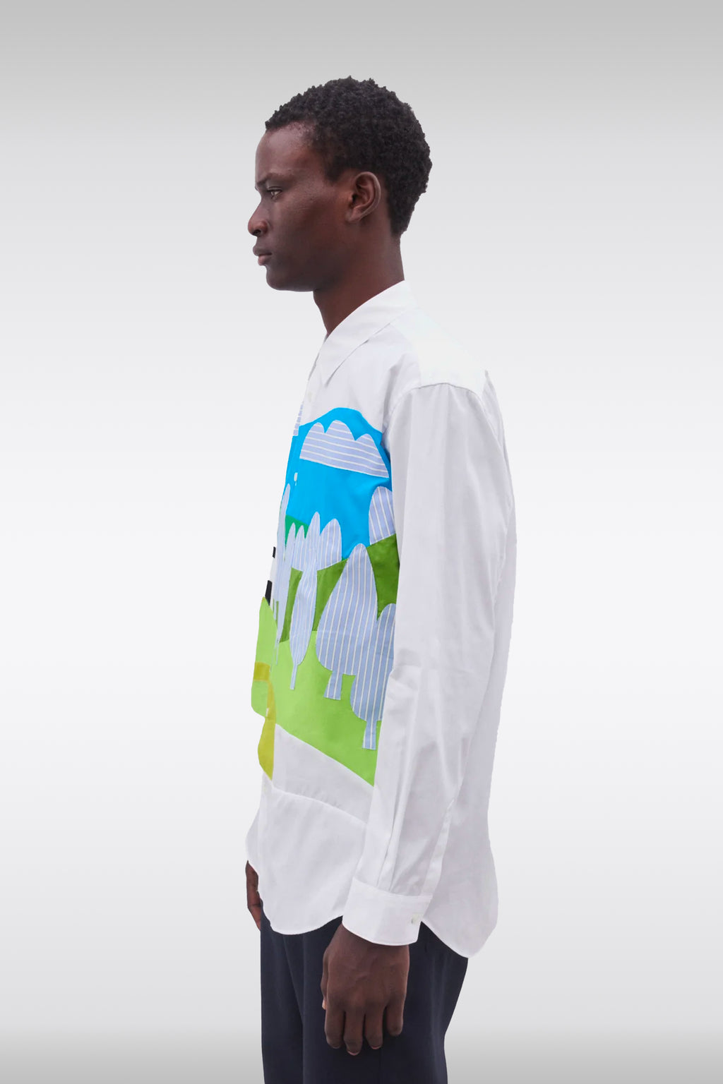 alt-image__White-cotton-shirt-with-patchwork-detailing-featuring-a-landscape-design