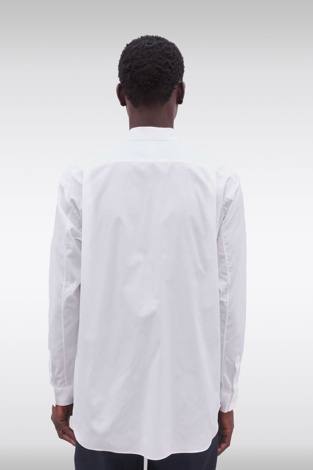 alt-image__White-cotton-shirt-with-patchwork-detailing-featuring-a-landscape-design