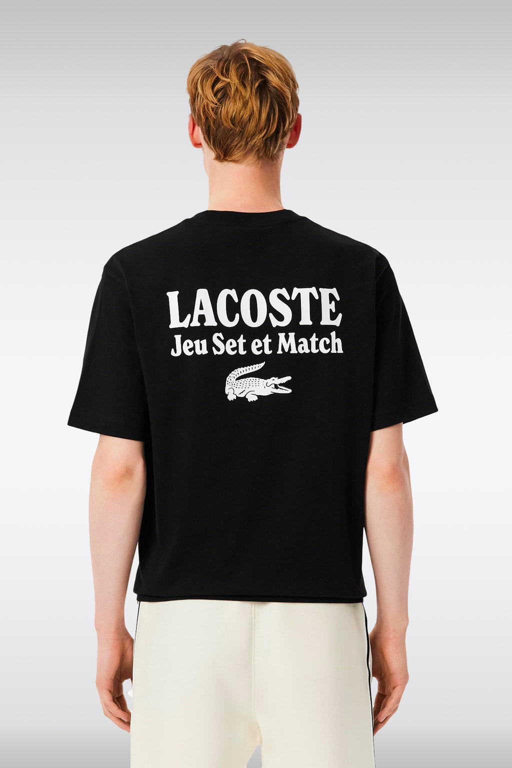alt-image__T-shirt-nera-in-cotone-con-slogan-al-petto-e-sul-retro