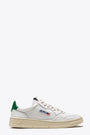 White leather low sneaker with green back tab - Medalist 